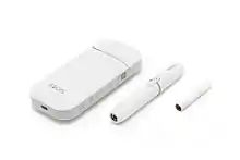 IQOS, consisting of a charger, holder, and tobacco stick.