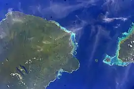 Satellite image of eastern half of Savaiʻi island (left of photo) with tiny Apolima & Manono islands and the western tip of Upolu. (NASA photo, 2006)