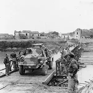 An Otter Light Reconnaissance Car crossing a Bailey bridge over the Volturno river at Grazzanise, 14–16 October 1943.