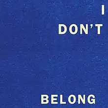 A static blue field with the text "I Don't Belong" written across the blue field.