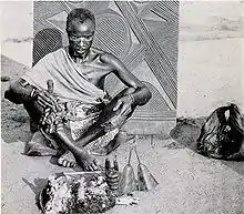 Image 7An early-20th-century Igbo medicine man in Nigeria, West Africa.Credit: UkabiaFor more about this picture, see Divination in Traditional African Religions, African divination, Traditional African medicine and Igbo religion.