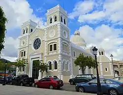 Photograph of the Iglesia de San Antonio de Padua, an imposing church structure with two towers front and a central dome