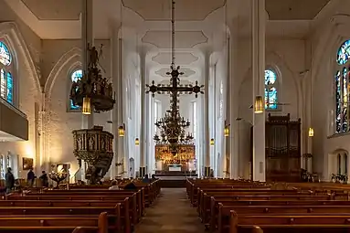 Interior facing the altar, with pupit, cross and choir organ
