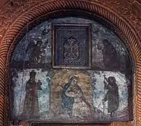 Tympanum with fresco depicting the Virgin Mary and saints