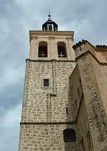 A stone tower.  Crosses can be seen in the windows.