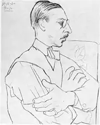 Pencil drawing of Stravinsky sitting sideways, arms crossed