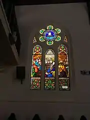 One of the stained glass windows of the Martin Luther Church, depicting Pentecost, produced by the Conrad House