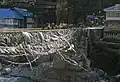 Bridge in the middle of town with prayer flags