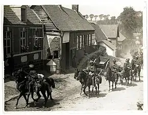 Punjabi Muslim cavalry marching through a French village