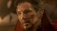Doctor Strange dusting away after Thanos collected all of the Infinity Stones and snapped his fingers, wiping out half of all living life in the universe.