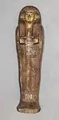 Lid of gilded coffin shaped like a mummy