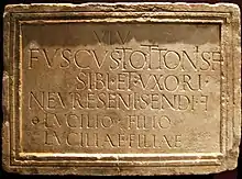 Epitaph of Fuscus at Arrien-en-Bethmale (Ariège) with reversed F to abbreviate the word filiae.