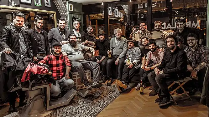 Barbershop in Bucharest around 2016. Men find the lost comradery between their peers, inside such "new traditional" barbershops, a revival of the old ones.