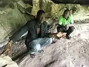 Inside the Tano Rock Shrine with tour guide in Tanoboase, Ghana