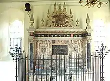 elaborate monument surrounded by railings