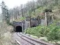 The western end of the tunnels which run beneath the steeply sloped Commoncraig. The tunnel on the right has been out of use since electrification of the Wemyss Bay line in 1966.