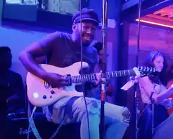 Isaiah Sharkey performing with Maurice Brown in New York City in 2021