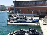 Israeli maritime police Defender-class boat Hazon and water scooter in Eilat Marina, Israel.