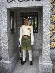 Royal guard in a traditional samping.