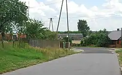Houses by the road in Istok