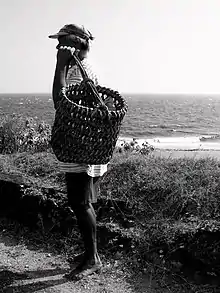 An Ivatan holding one of many types of traditional Ivatan baskets