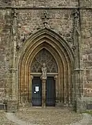 Gothic portal with St. Nikolai statue