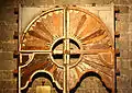 Old Mudejar-style hardwood door currently displayed under the choir loft