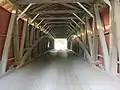 View of the inside of the bridge showing the Burr arch truss