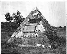 Monument erected 1904 by the Jackson Iron Company at the site of the discovery of ore after destruction of the stump.  The monument is now located on US 41.