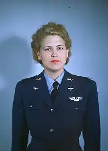 A portrait of standing Jacqueline Cochran in uniform looking directly at the camera