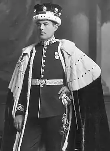 Monochrome photograph of Abinger wearing a crown and coronation robes