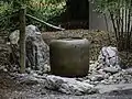 Stone water fountain and cistern at the Japanese Garden at Norfolk Botanical Garden, Norfolk, Virginia