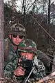 Captain (CPT) Rod Cromer, supply officer, 1st Brigade, 25th Infantry Division, United States Army, checks the defensive perimeter of a Japanese soldier during bilateral training in logistics given by the 1st Infantry Division, Japanese Ground Self Defense Force, during Exercise Orient Shield