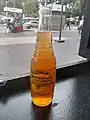 A glass bottle of Jarritos Tamarindo using a bottle design found in Mexico
