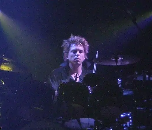 Cooper performing with The Cure in 2008