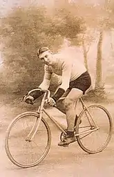 Male cyclist posed riding a bicycle