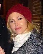 Jenn Lyon with a red winter hat in 2016