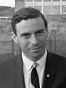 Jim Clark in a black suit with a shirt and tie