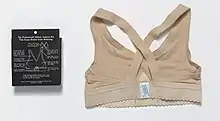 Jogbra, back view with packaging, "The Professional Athletic Support Bra That Keeps Breasts from Bouncing."