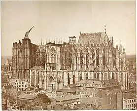 The unfinished cathedral in 1855. The medieval crane was still in place, while constructions for the nave had been resumed earlier in 1814.