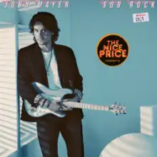 In the album cover, John Mayer in a light blue colored room standing with his guitar. Two stickers appear, One reading "The Nice Price", and another in a form of a price tag reading Apple Music and the year of the album's release, 2021.