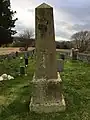 The oblong, stone tombstone in Balmerino cemetery erected for John Thomson, the fifteenth minister of Balmerino parish.