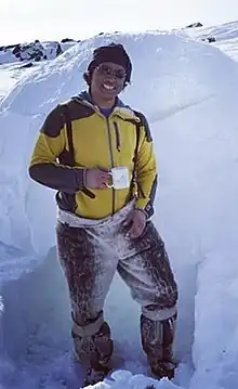 Johnny Issaluk builds an igloo.
