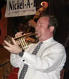 Jon-Erik Kellso playing the trumpet