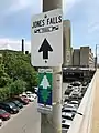 Signage for the Jones Falls trail near Fallsway and East Chase Street, north of Penn-Fallsway