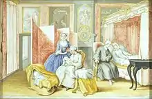 A bedroom with a young woman in white laying on the pink, canopy bed. A man in a gray coat is sitting next to her, leaning towards her. A woman in white is seated in the middle, nursing a swaddled baby, with a young woman in blue looking on. Next to them is a crib.
