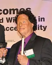 Joshua Miele accepting an award at the FCC Chair's Awards for Advancement in Accessibility in 2014.