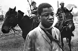 A prisoner taken by Rhodesian Security Forces in the fall of 1977 stands with a rope around his neck. Taken for Associated Press. Second of three photos that were awarded a 1978 Pulitzer Prize.