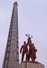 "Worker, peasant and the intellectual" in front of the Juche Tower, Pyongyang