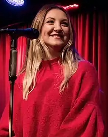 Color photograph of Julia Michaels performing live in November 2017